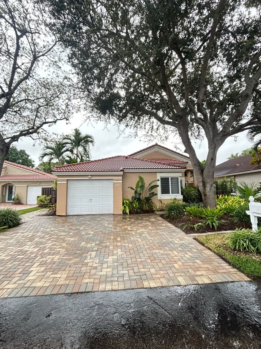Completed driveway clear coat sealant application in Miami-Dade